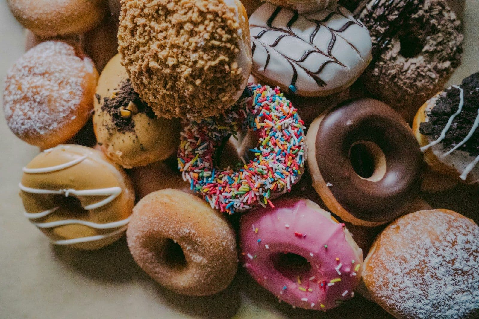Assorted glazed, chocolate and sprinkle donuts