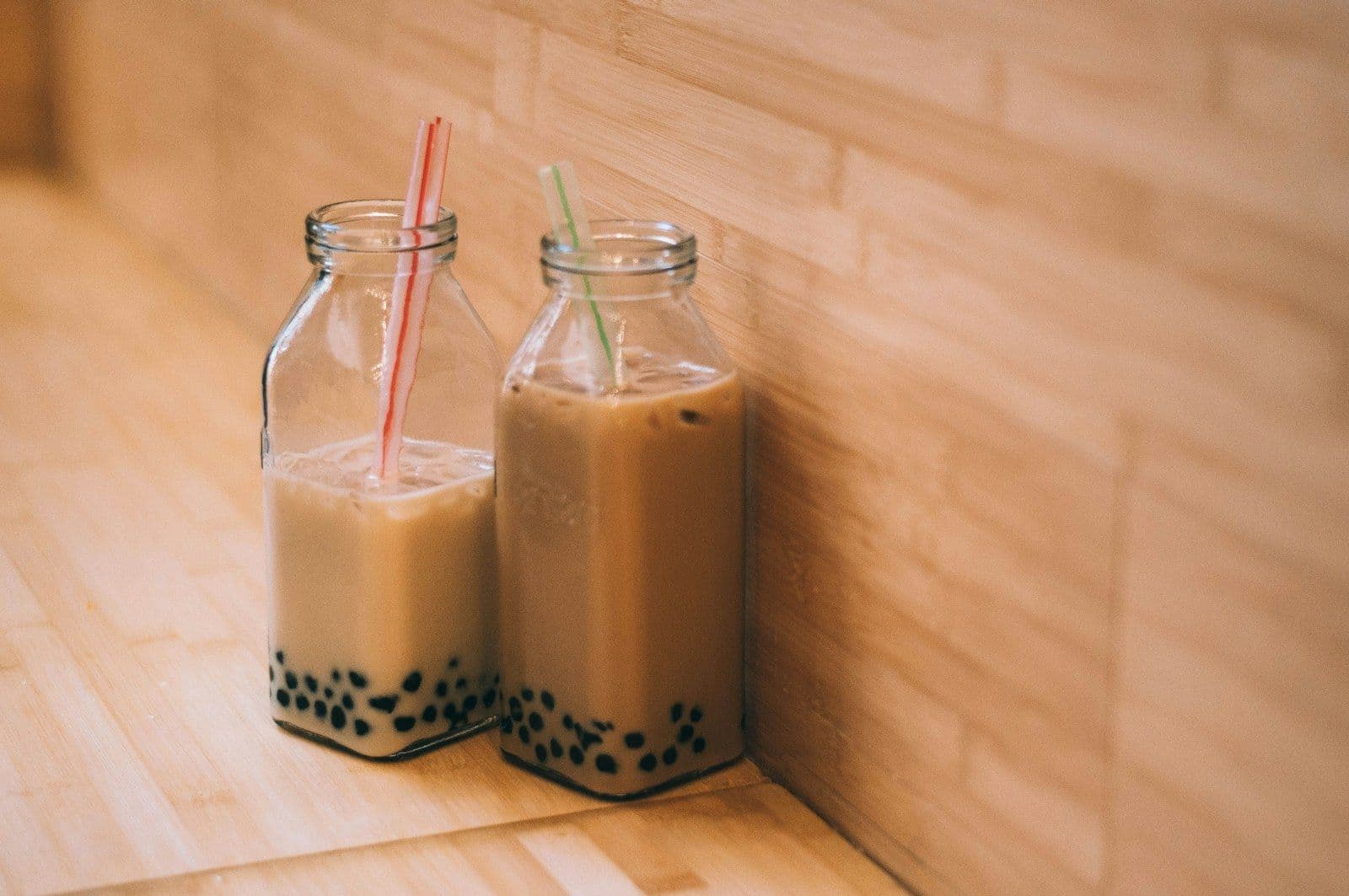 Two milk teas with tapioca pearls